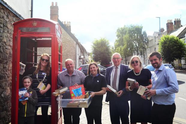 Chard & Ilminster News: Chard phone box ; Ophelia Lynch, Claire Brown [Deputy Mayor], Jason Baker [Chard Town Councillor], Natalie Larcombe [1st Chard Brownies Leader], Paul Russell [Town Clerk], Beverley Newman [Democratic Services Manager] and Tim Dickham [Events Officer]